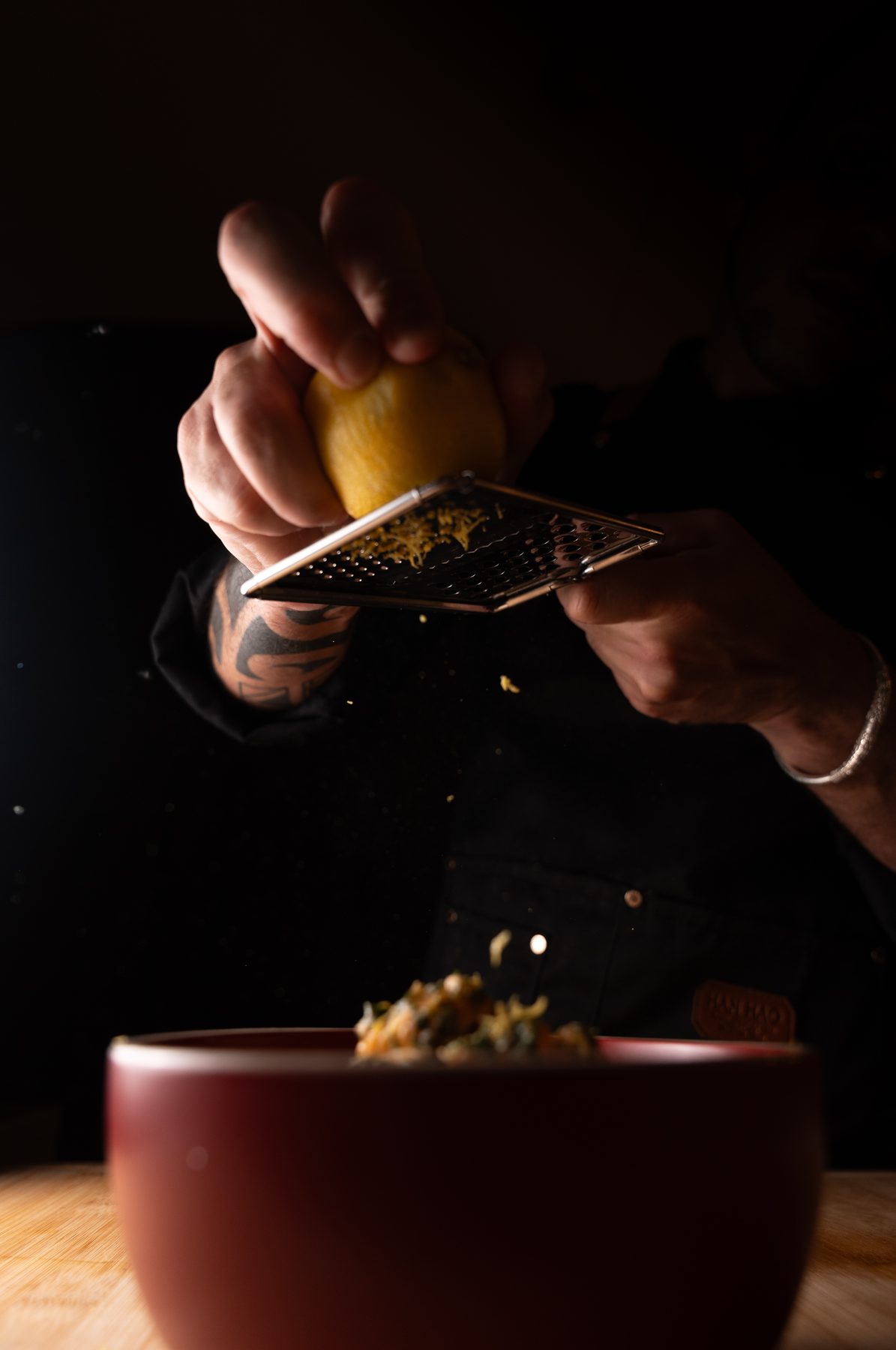 Chef Felipe Sharp finishing a private dining dish